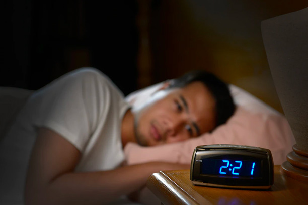 Insomnia Man Looking at Clock