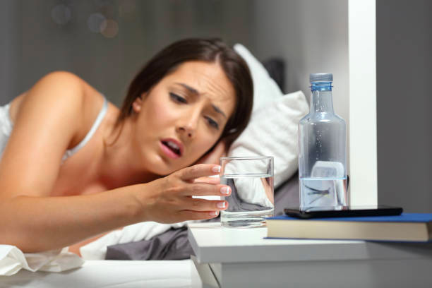 woman waking up to drink